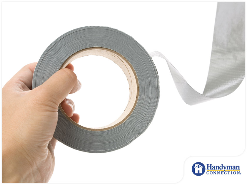 https://www.handymanconnection.net/mason/wp-content/uploads/sites/29/2021/05/2062-1618629380-person-holding-a-roll-of-duct-tape.jpg