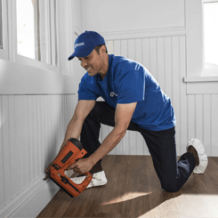 remodeling handyman using nail gun