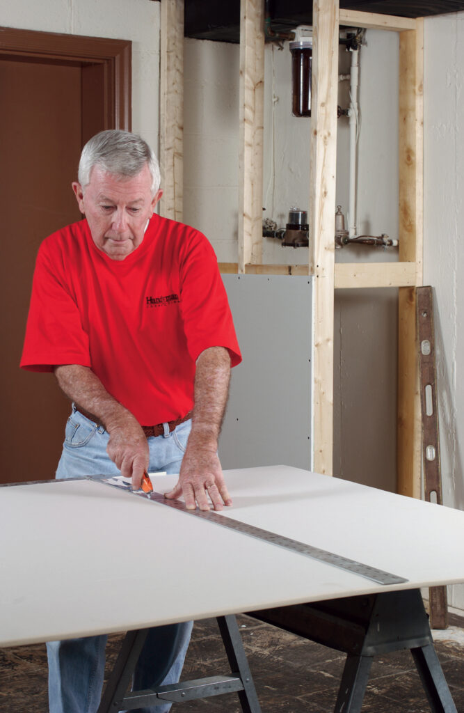 handyman from Handyman Connection installing new drywall