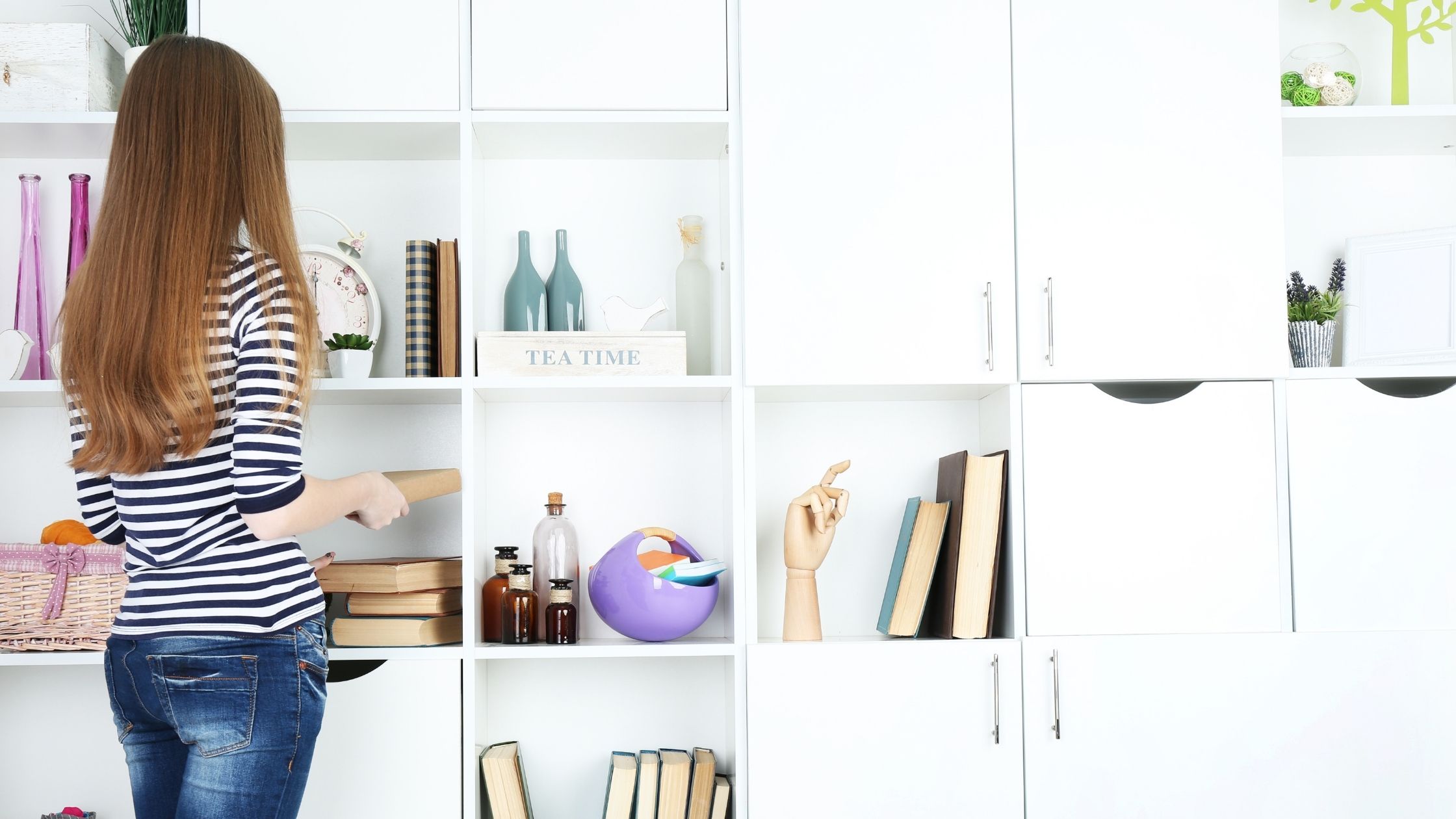 woman standing near shelving